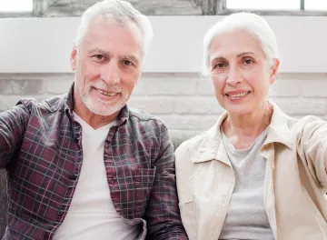 Smiling older couple sitting together
