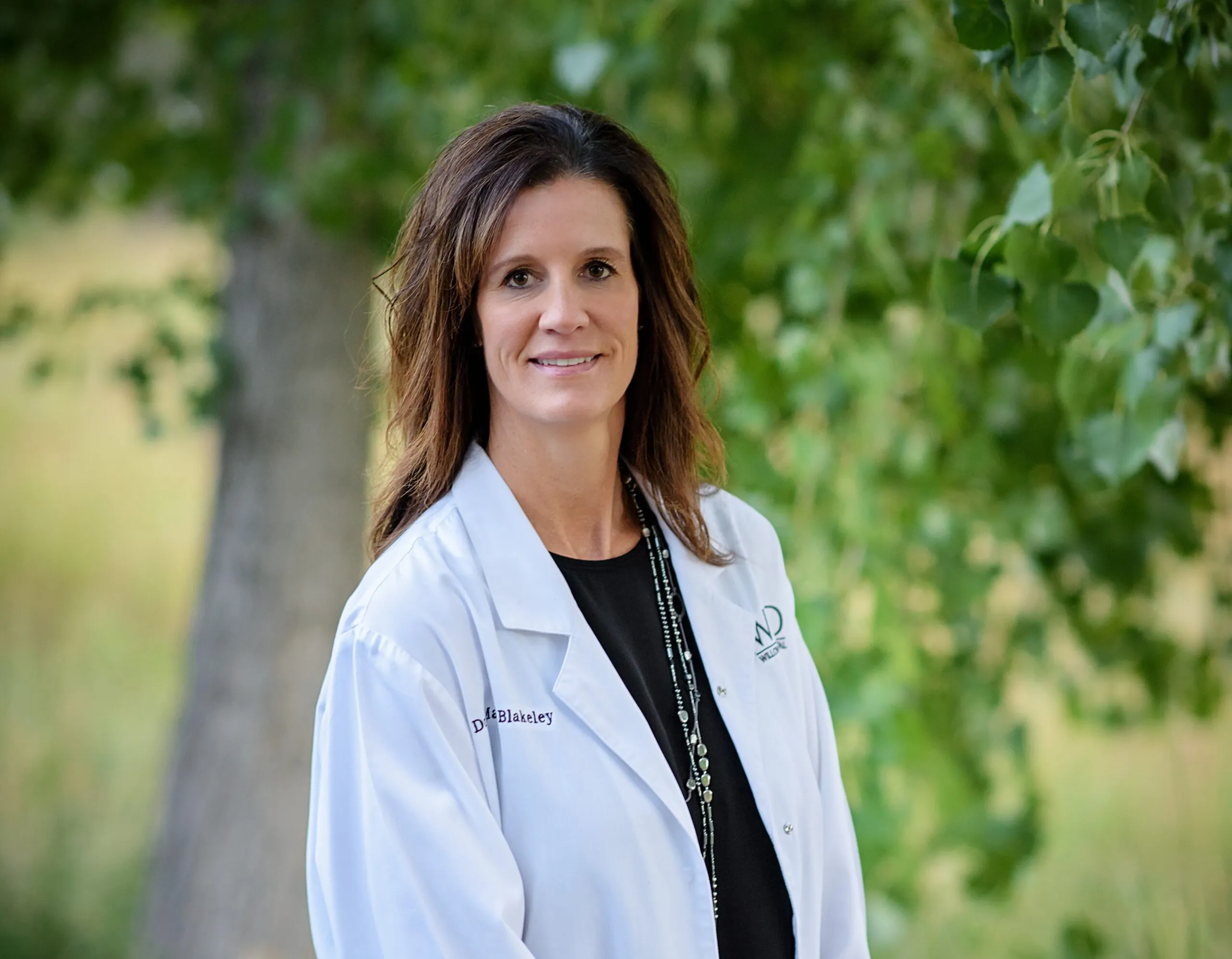 Dr. Mary Blakeley, Co-Founder of Stanbrick Dental Group, in her white coat