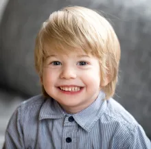A young boy smiling in the dental chair