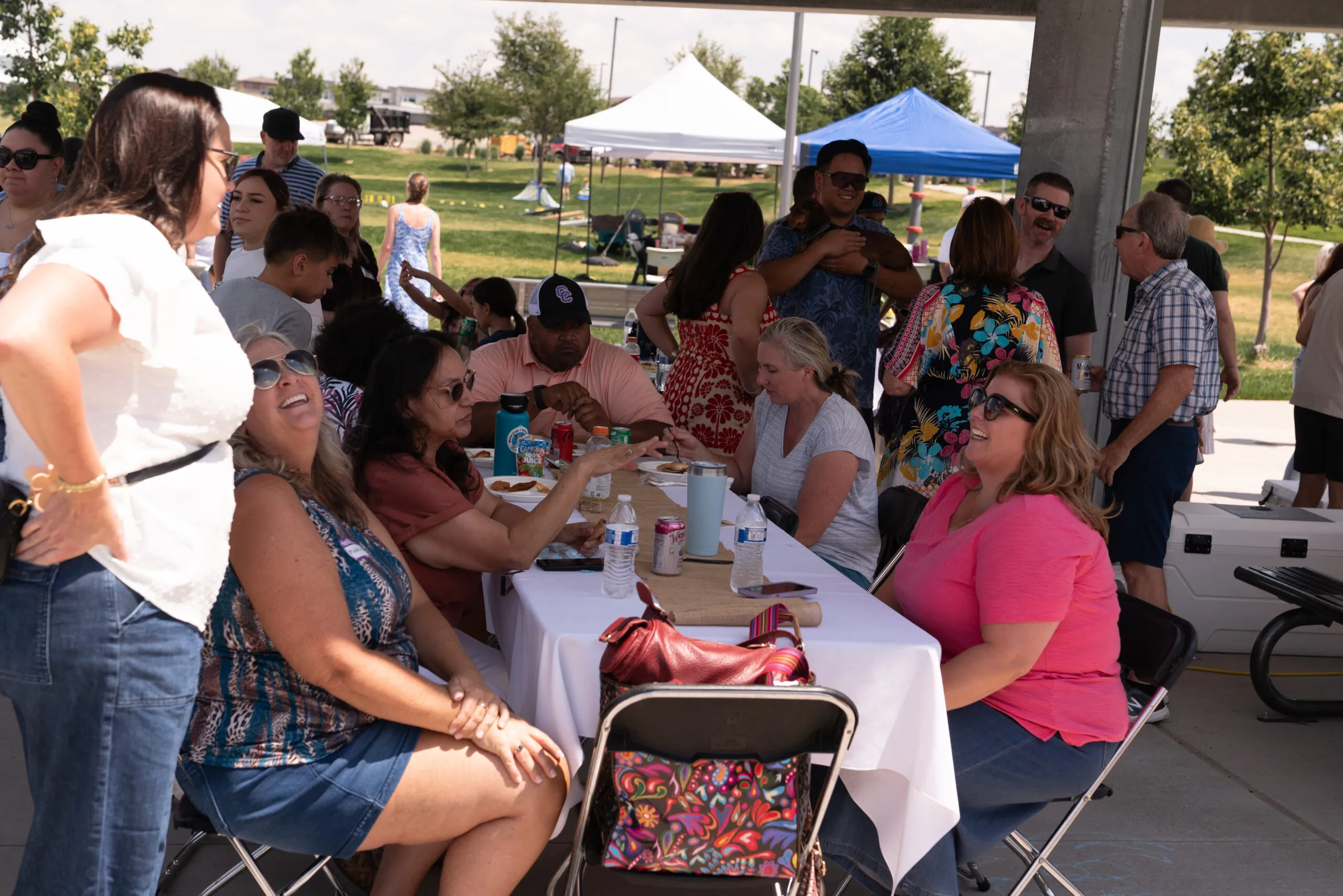 Team members sharing a meal at the summer barbecue