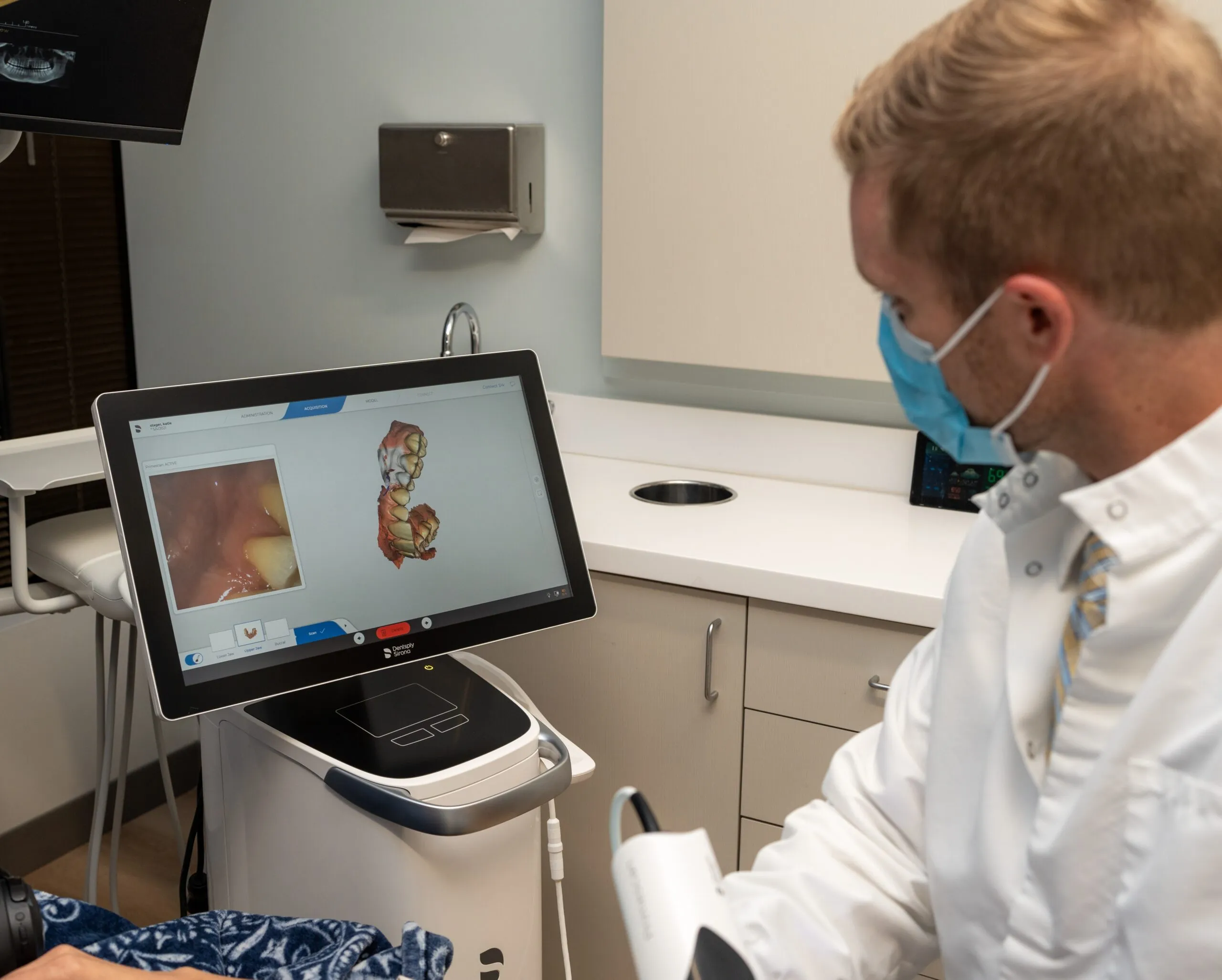 A clinician capturing detailed digital records with an intra-oral scanner