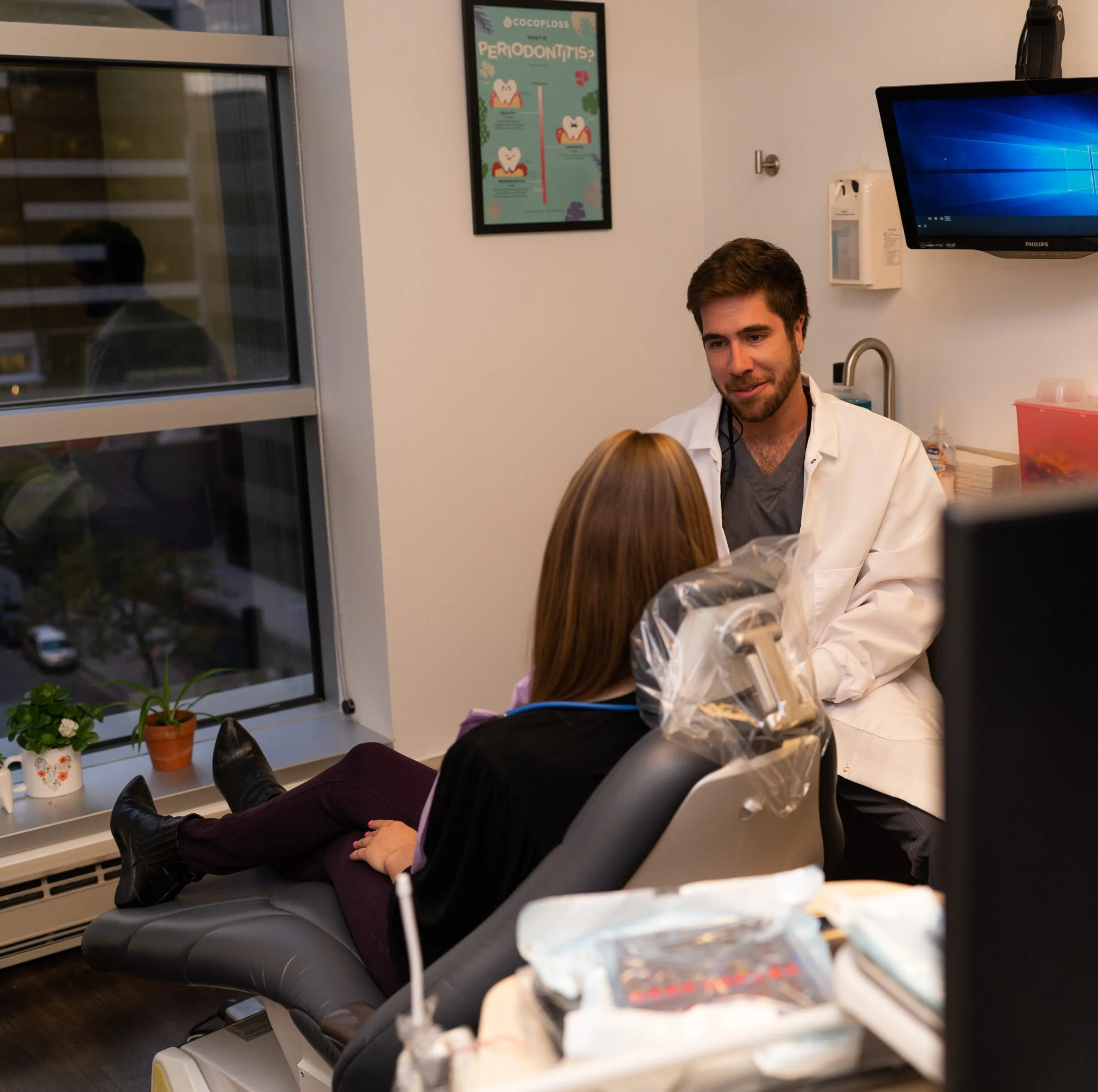 A Stanbrick dentist listening to a patient in the consultation room