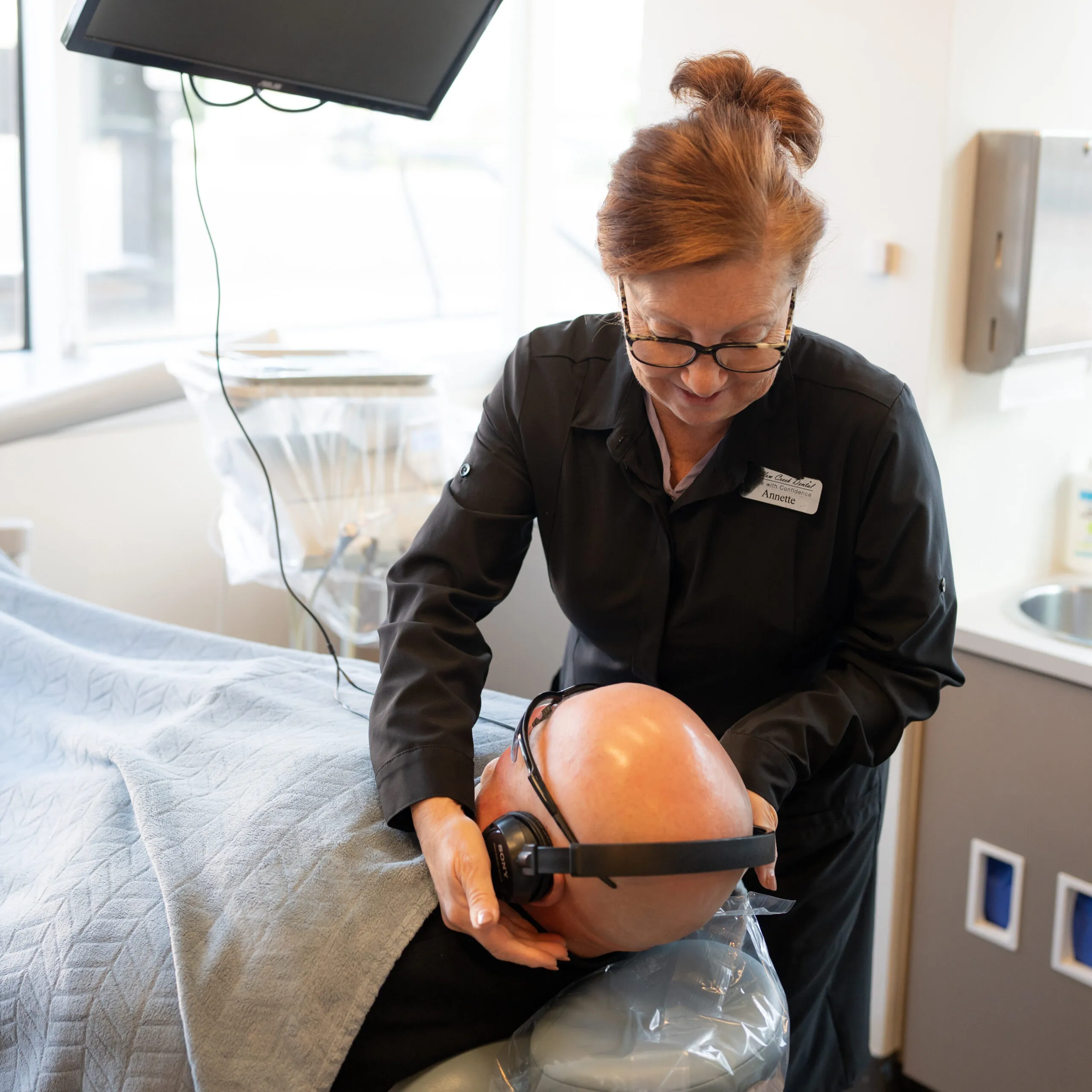 A Stanbrick team member caring for a patient in the treatment room