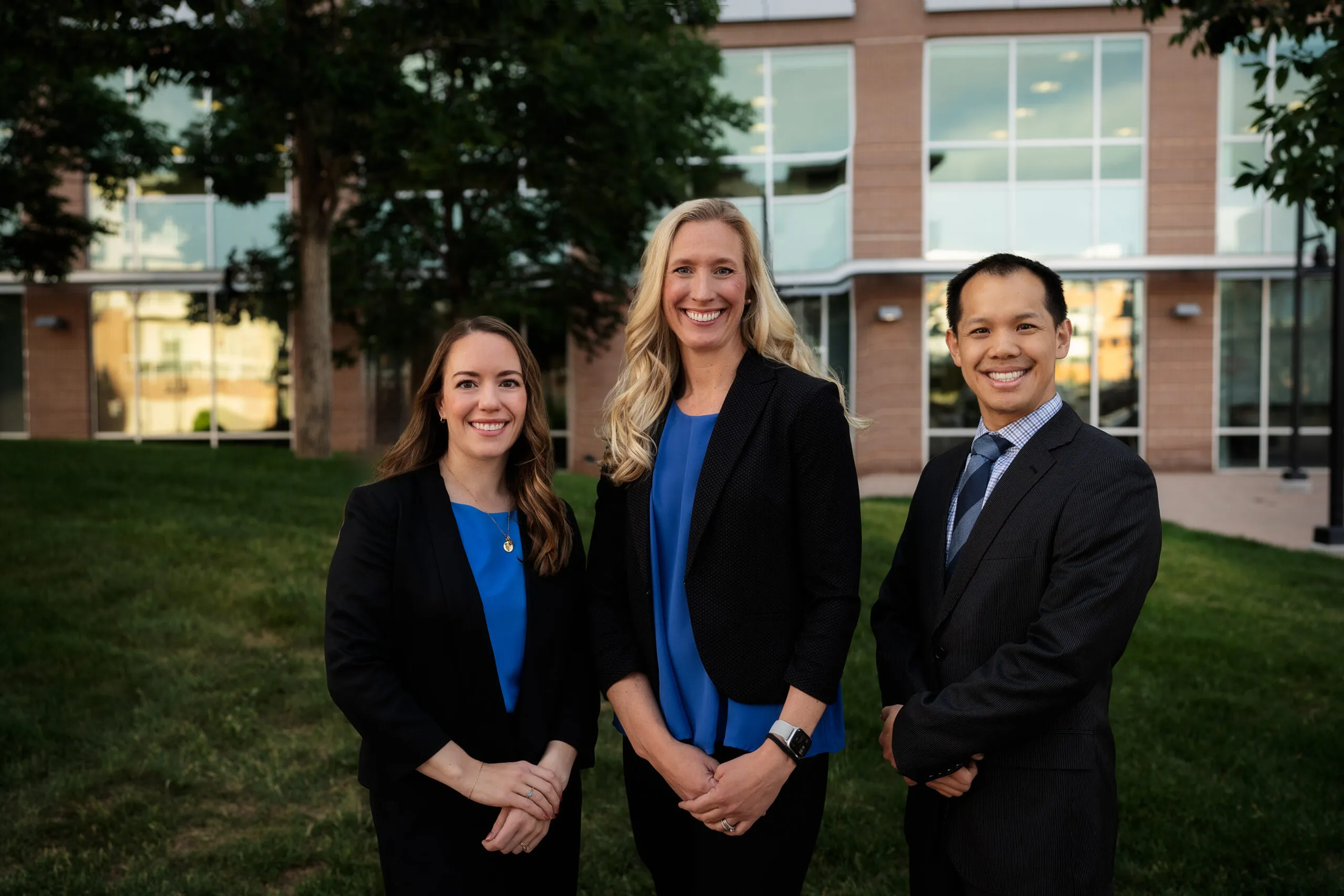 Three Willow Creek Dental doctors standing together outside the practice